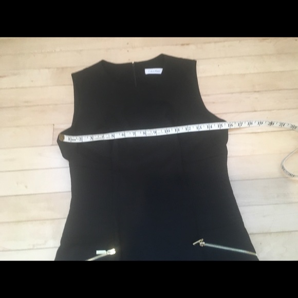 Lovely Calvin Klein black fitted dress, with gold accent pockets. - Picture 16 of 16